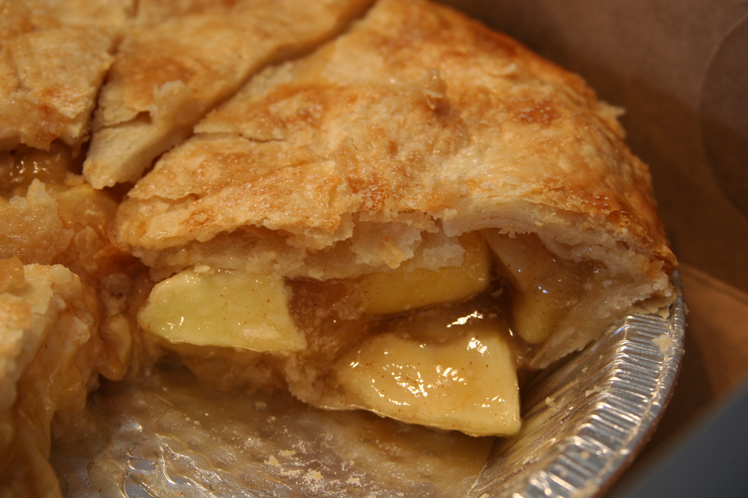 A sliced apple pie